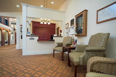 Reception area with seating and a service desk