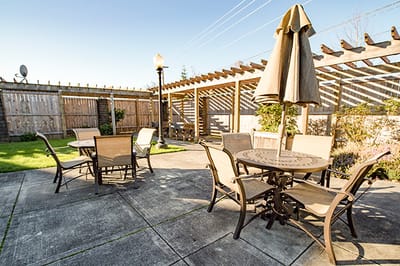 Outdoor seating area with patio tables and umbrellas