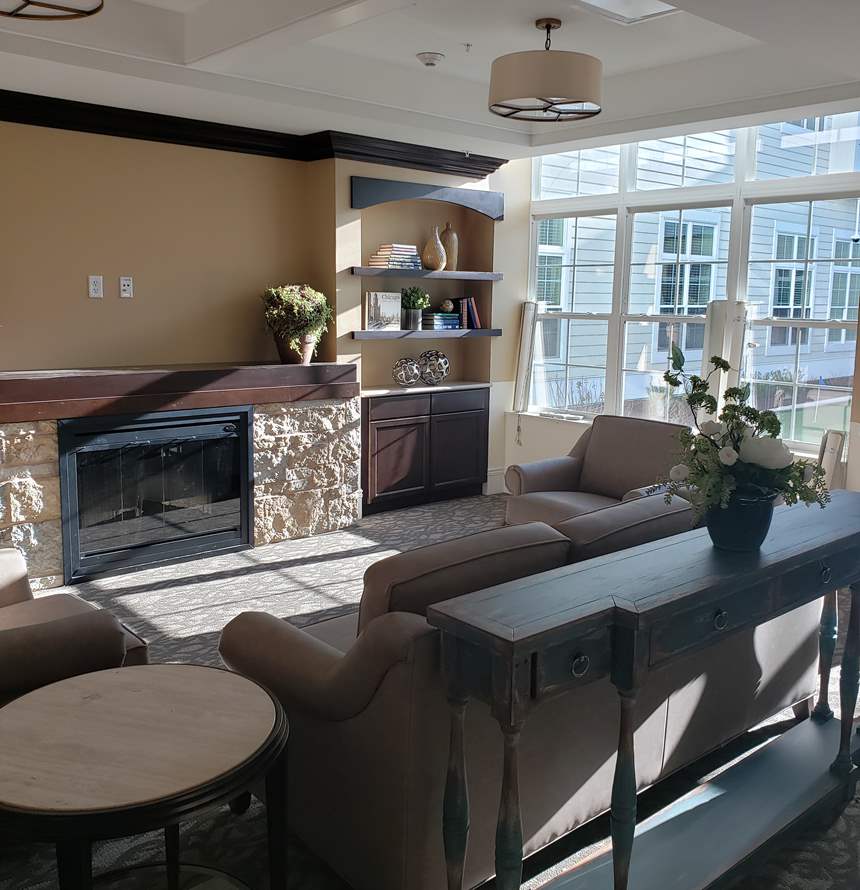 Bright and cozy common area with seating and decor