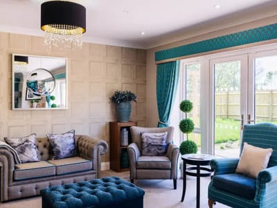 Bright and cozy lounge area with seating and decor
