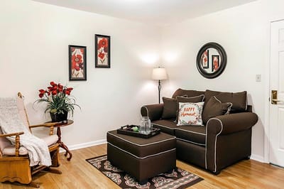 Cozy lounge area with floral decor and seating