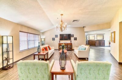 Seating area in a bright common room with decor