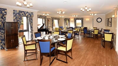 Interior view of a dining room with tables and chairs