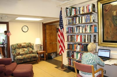 Common area with a resident working on a computer