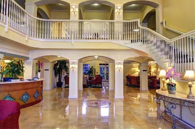 Interior view of a spacious lobby with a grand staircase