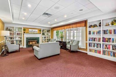 Common area with seating and bookshelves