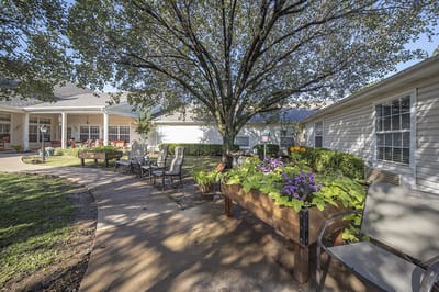 Outdoor garden area with seating and flowers