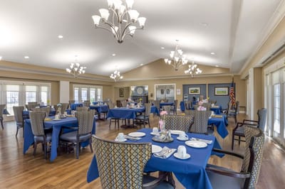 Bright dining room with tables set for a meal