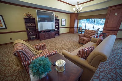 Common area with seating and bookshelf