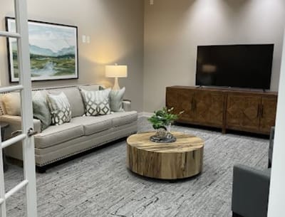 Cozy interior lounge area with a sofa and TV