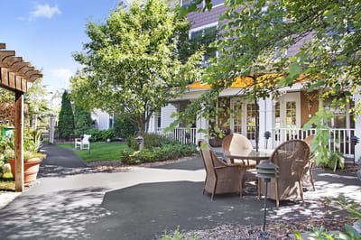 Outdoor seating area surrounded by greenery