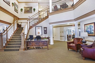 Interior view of a welcoming lobby with staircase