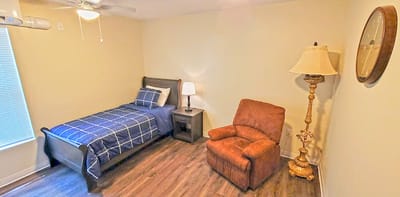 Cozy private room with a bed and seating area