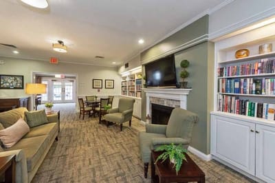 Cozy common area with comfortable seating and bookshelves