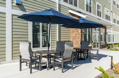 Outdoor patio area with tables and umbrellas