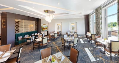 Elegant dining room setup with tables and chairs