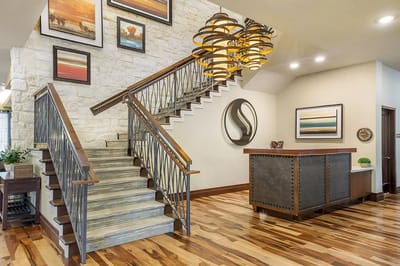 Bright and welcoming reception area with staircase