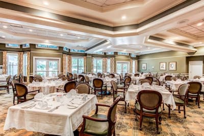 Elegant dining room setup with tables and chairs