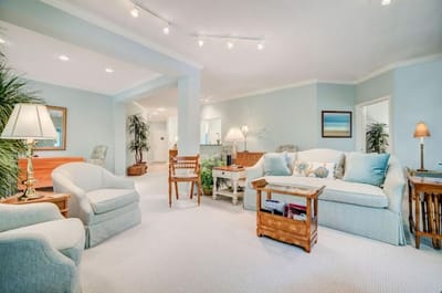 Bright and cozy common area with seating and decor