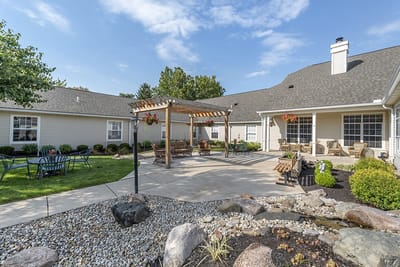 A serene outdoor area with seating and gardens