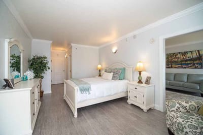 Bright, spacious resident room with a bed and furnishings