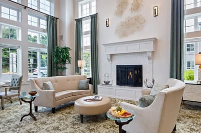 Welcoming common area with seating, fireplace, and snacks