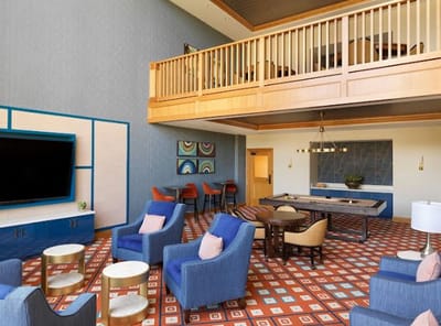 Bright lobby with comfortable seating and artwork