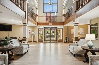 Interior lobby of a senior living facility with seating