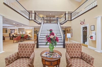 Interior view of a common area with staircase and seating