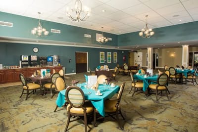 Dining room with tables set for a meal.