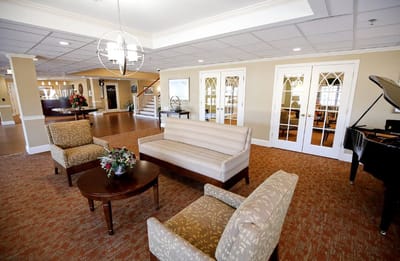 Interior seating area with couches and piano