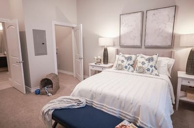 Cozy interior of a resident room with bed and decor