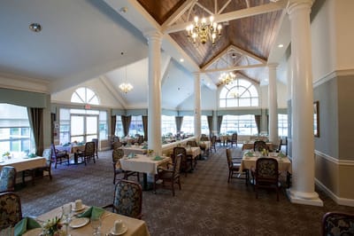 Bright dining room with tables set for meals