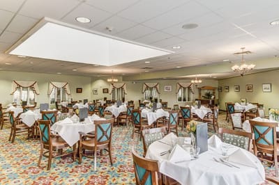 Dining room setup with tables and chairs