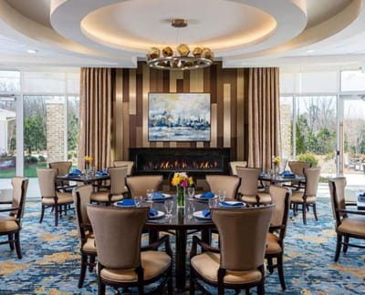 Elegant dining room setup with flowers and table settings