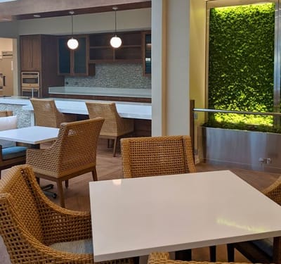 Modern dining area with chairs and green decor