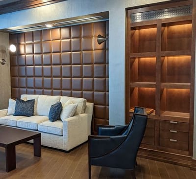 Stylish lounge area with a sofa and decorative wall