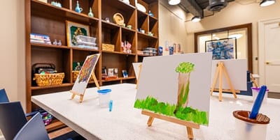 Art supplies and painting setup in a creative space
