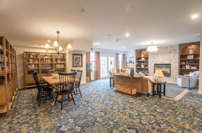 Bright common area with seating and bookshelves