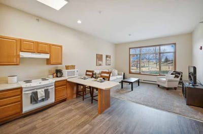 Bright interior view of a living space with kitchenette