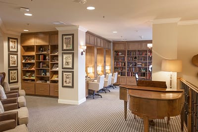 Cozy common area with bookshelves and seating