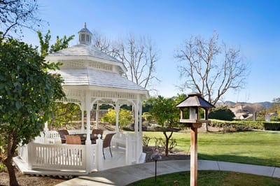 Outdoor gazebo in a landscaped garden