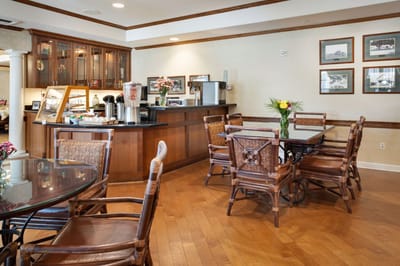 Bright dining area with wooden furniture and coffee station