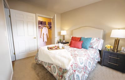 Cozy resident room with a bed and bedside table