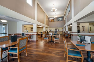 Dining area with tables and chairs for residents