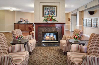 Cozy common area with seating and a fireplace
