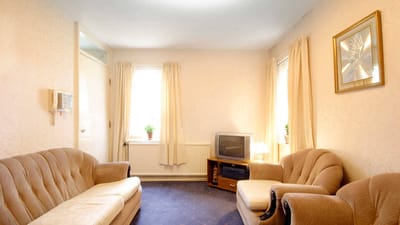 Cozy interior lounge with sofas and a television