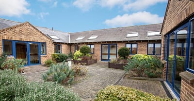 Outdoor courtyard with plants and seating