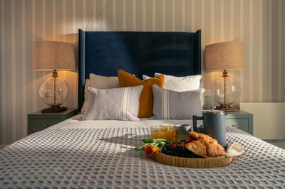 Cozy bedroom setup with breakfast tray and decor