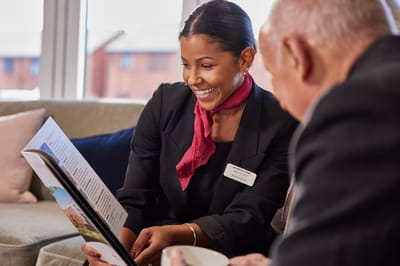 Staff member assisting a resident with information